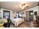 Bright bedroom with a queen-size bed and ensuite bathroom access at 3401 Stony Brook Cir, Newton, NC 28658