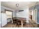 Bright dining area with wood table and chairs, view into kitchen at 3401 Stony Brook Cir, Newton, NC 28658