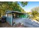 Carport and side view of green mobile home at 3401 Stony Brook Cir, Newton, NC 28658