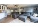 Open living area with L-shaped sofa and kitchen view at 3401 Stony Brook Cir, Newton, NC 28658