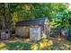 Wooden storage shed with metal roof in backyard at 3401 Stony Brook Cir, Newton, NC 28658