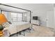 Bedroom with a bed, dresser, and light hardwood floors at 7062 Quail Hill Rd, Charlotte, NC 28210