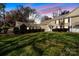 Evening view of a townhouse with garage and lush lawn at 7062 Quail Hill Rd, Charlotte, NC 28210