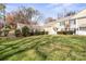 Townhouse with attached garage and well-maintained landscaping at 7062 Quail Hill Rd, Charlotte, NC 28210