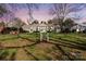 Evening view of a two-story townhouse in a quiet neighborhood at 7062 Quail Hill Rd, Charlotte, NC 28210