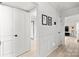 Bright hallway with wainscoting and hardwood floors at 7062 Quail Hill Rd, Charlotte, NC 28210