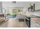 Modern kitchen with white shaker cabinets, stainless steel appliances, and light wood countertops at 7062 Quail Hill Rd, Charlotte, NC 28210