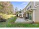 Private patio with seating and adjacent green space at 7062 Quail Hill Rd, Charlotte, NC 28210