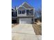 Two-story house with gray siding, white garage door, and landscaping at 3540 Nimbell Rd, Monroe, NC 28110