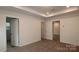 Main bedroom with carpet, neutral walls, and doors to bathroom and other rooms at 3540 Nimbell Rd, Monroe, NC 28110