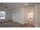 Large bedroom with carpet and access to another room at 3543 Nimbell Rd, Monroe, NC 28110