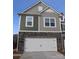 Two-story home with stone and siding accents, two-car garage at 3543 Nimbell Rd, Monroe, NC 28110