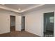 Main bedroom with tray ceiling and access to private bathroom at 3543 Nimbell Rd, Monroe, NC 28110