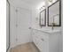 Elegant bathroom with double vanity and frameless shower at 7415 Linda Lake Dr, Charlotte, NC 28215