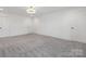 Spacious bedroom with grey carpet and double doors at 7415 Linda Lake Dr, Charlotte, NC 28215