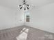 Well-lit bedroom with grey carpet and double door closet at 7415 Linda Lake Dr, Charlotte, NC 28215