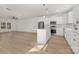 Modern white kitchen with stainless steel appliances and island at 7415 Linda Lake Dr, Charlotte, NC 28215