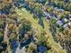 Aerial view of home with golf course in the background at 94 Heritage Dr, Lake Wylie, SC 29710