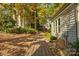 Side view of backyard with wooden pathway leading to the house at 94 Heritage Dr, Lake Wylie, SC 29710