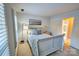 Comfortable bedroom with a white wood sleigh bed and ample natural light from window at 94 Heritage Dr, Lake Wylie, SC 29710