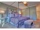 Bedroom featuring a four-poster bed, neutral paint, and large windows for ample natural light at 94 Heritage Dr, Lake Wylie, SC 29710