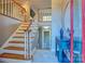 Bright foyer with staircase, hardwood floors and a glimpse of the lower level at 94 Heritage Dr, Lake Wylie, SC 29710