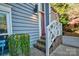 Inviting front entrance featuring a red door, brick steps and greenery surrounding the home at 94 Heritage Dr, Lake Wylie, SC 29710
