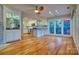 Open-concept kitchen with white cabinetry, stainless steel appliances, and a built-in bar area at 94 Heritage Dr, Lake Wylie, SC 29710