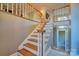 Bright staircase featuring wood stairs, white risers, and white and wood banister at 94 Heritage Dr, Lake Wylie, SC 29710