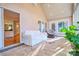 Bright sunroom features a vaulted ceiling, tile flooring, and access to outdoor spaces at 94 Heritage Dr, Lake Wylie, SC 29710