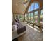 Bright sunroom with tile floors, high ceilings, and large windows overlooking the backyard at 94 Heritage Dr, Lake Wylie, SC 29710