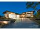 Modern home with a three-car garage, stone accents, and a well-manicured lawn in a cul-de-sac at 109 Twiggs Ln, Mooresville, NC 28117