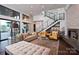 Bright living room with modern decor, fireplace, and staircase at 109 Twiggs Ln, Mooresville, NC 28117