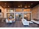 An elegant outdoor living space features a dining area and comfortable seating with views through large sliding glass doors at 109 Twiggs Ln, Mooresville, NC 28117
