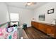 Cozy bedroom features a ceiling fan, wood floors, and ample natural light from the window at 126 Fleming Dr, Statesville, NC 28677