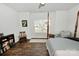 Bright bedroom featuring hardwood floors, a window and a four-poster bed at 126 Fleming Dr, Statesville, NC 28677