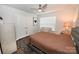 Comfortable bedroom features a ceiling fan, window, and a cozy quilted bedspread, creating a relaxing atmosphere at 126 Fleming Dr, Statesville, NC 28677