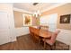 The dining room has a light fixture, natural light, and wood flooring at 126 Fleming Dr, Statesville, NC 28677