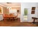 A light fixture hangs above the dining room's wooden table and chairs, offering great views at 126 Fleming Dr, Statesville, NC 28677