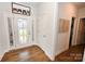 Welcoming entryway with decorative glass front door, sidelights, and hardwood flooring at 126 Fleming Dr, Statesville, NC 28677