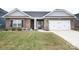 Charming single-story brick home featuring a well-manicured lawn and attached two-car garage at 126 Fleming Dr, Statesville, NC 28677