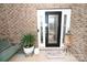 Welcoming front entrance with decorative glass door, side lights, and brick accents, creating curb appeal at 126 Fleming Dr, Statesville, NC 28677