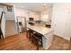 Spacious kitchen with large island, stainless appliances, and sleek white cabinets at 126 Fleming Dr, Statesville, NC 28677