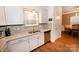 Granite countertops complement the stainless steel appliances and white cabinets in this modern kitchen at 126 Fleming Dr, Statesville, NC 28677