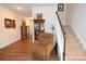 Inviting living room featuring hardwood floors, staircase and an upholstered easy chair at 126 Fleming Dr, Statesville, NC 28677