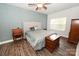 Comfortable main bedroom has wood floors, ceiling fan and neutral walls at 126 Fleming Dr, Statesville, NC 28677
