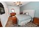 Comfortable main bedroom with wood floors, a ceiling fan and a beautifully decorated wall at 126 Fleming Dr, Statesville, NC 28677