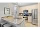 Modern kitchen featuring granite countertops, stainless steel appliances, and bright, natural light at 1909 Wilmore Walk Dr # 44, Charlotte, NC 28203