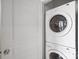 A practical laundry featuring a stacked washer and dryer set for efficient space saving at 1909 Wilmore Walk Dr # 44, Charlotte, NC 28203