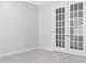 Bright bedroom featuring a carpeted floor and stylish double doors at 3067 Trace Meadow Ct, York, SC 29745